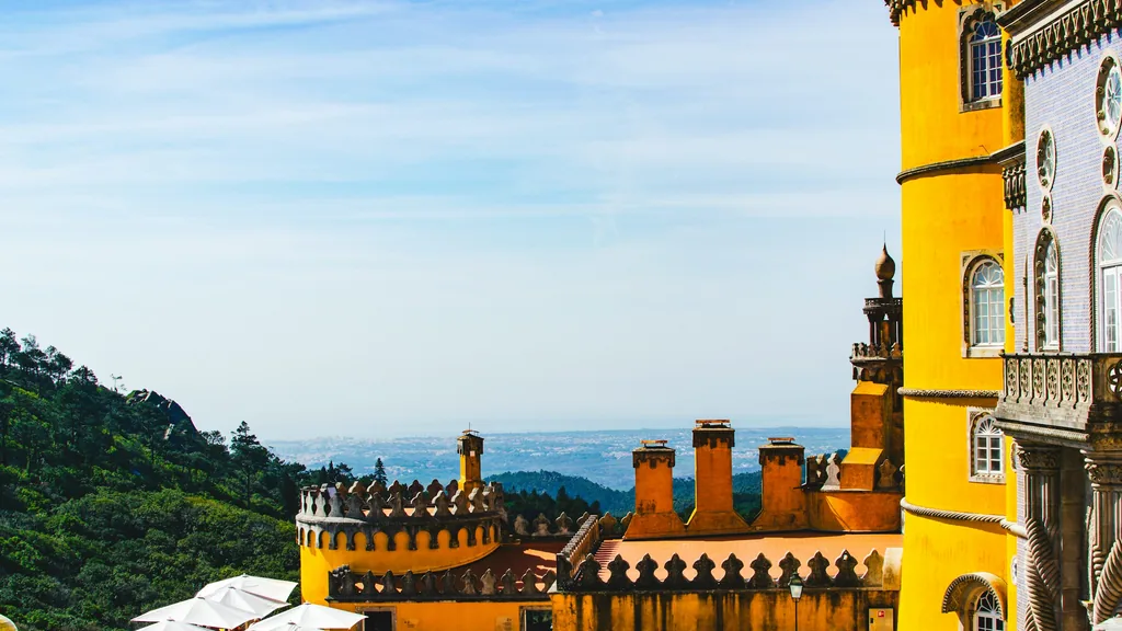 Pena Palace above the wooded hills of Sintra, Portugal